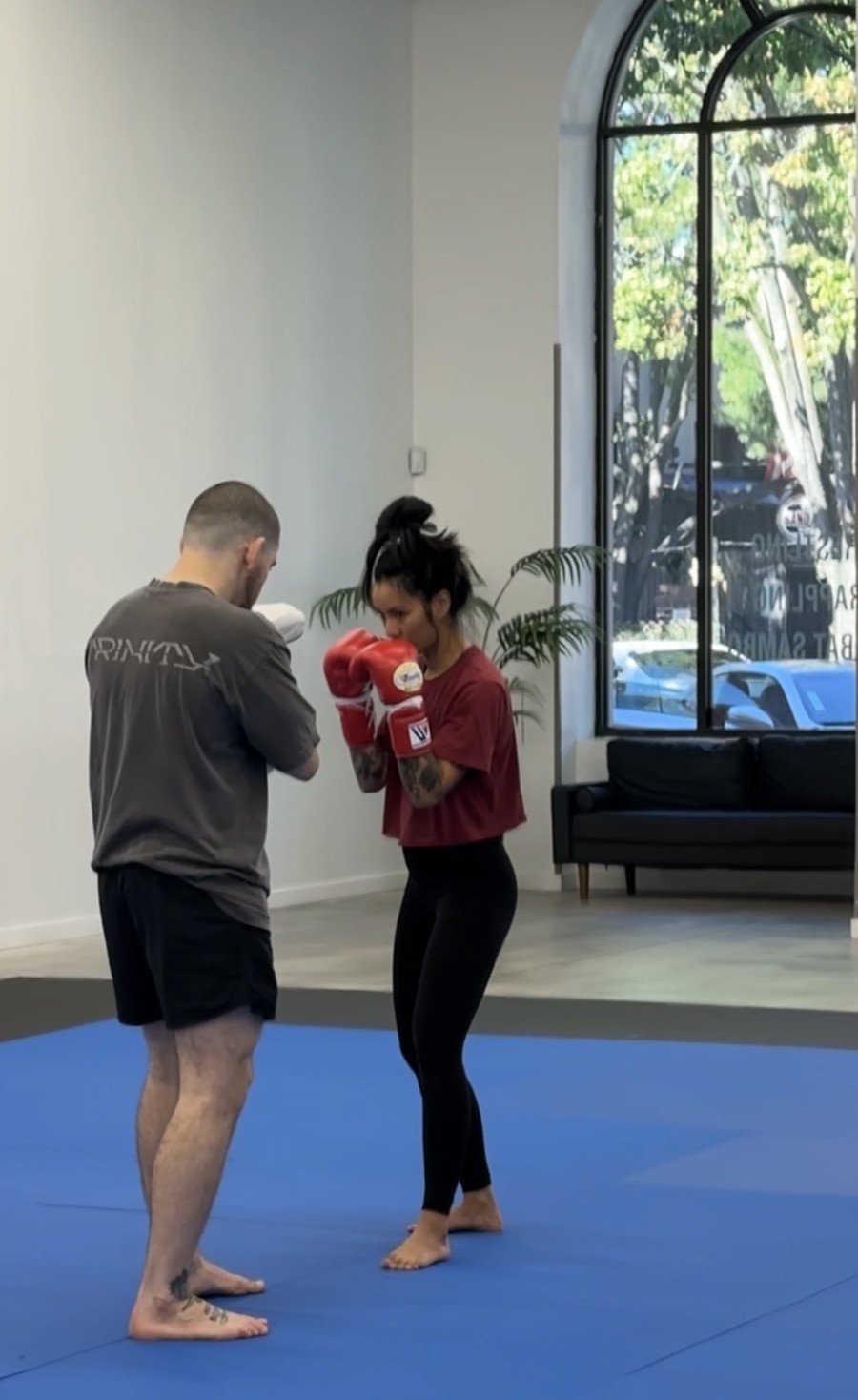 A coach working boxing technique