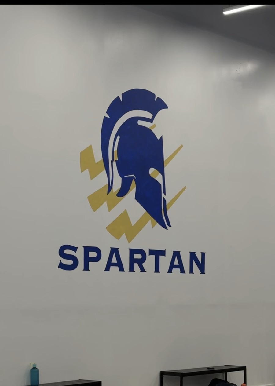 The Spartan Combat Sports logo wall